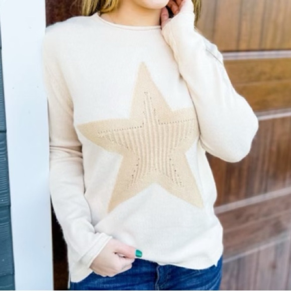 Women’s size small, cream colored easel pull over sweater. Like new.